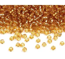 Rokajl Preciosa 10/0 - 2,3 mm s průtahem zlatá 10 g